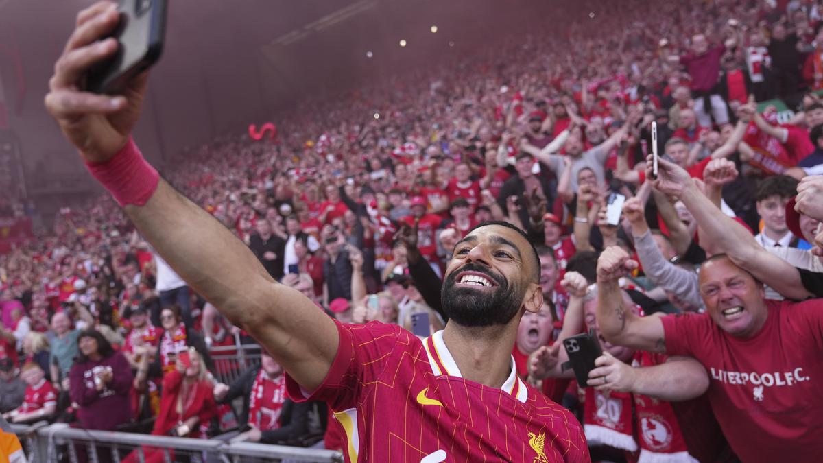 Party time at Anfield as Liverpool wins Premier League for record-equaling 20th top-flight title