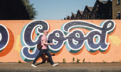 Why do our arms move to and fro when we walk?