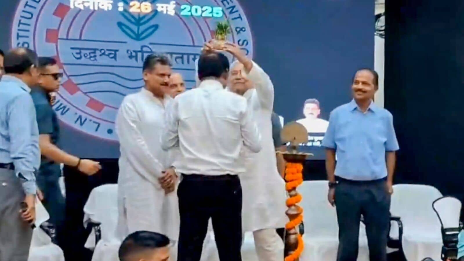 Viral video: Watch Bihar CM Nitish Kumar place gifted plant pot on man’s head on stage | Mint