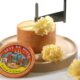 Why does cheese form flowers when scraped?