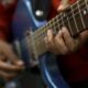 How does the material of a string affect an instrument’s sound?