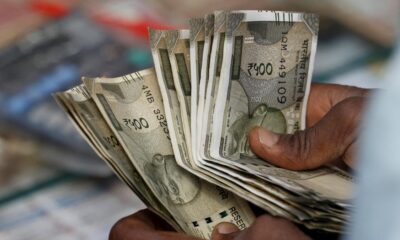 Rupee slumps 52 paise to close at 87.43 against U.S. dollar