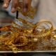 Gold climbs ₹119 to trade near record high ahead of U.S. Fed policy decision