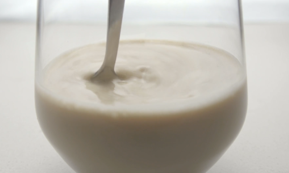 Why does stirring a liquid in a cup create a vortex?