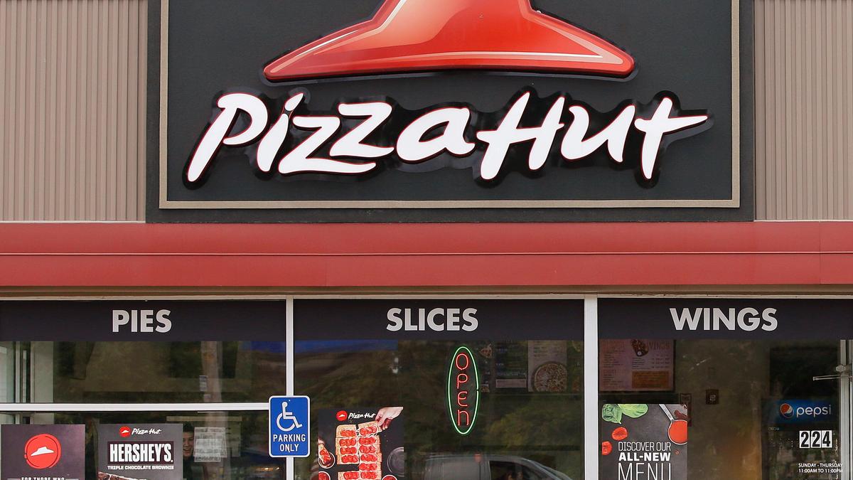 Pizza Hut's parent company Yum Brands says it's considering selling chain