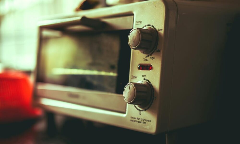 Why do microwave ovens sometimes overheat water?