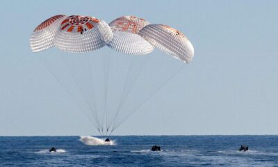 How do astronauts return from space and survive re-entry?